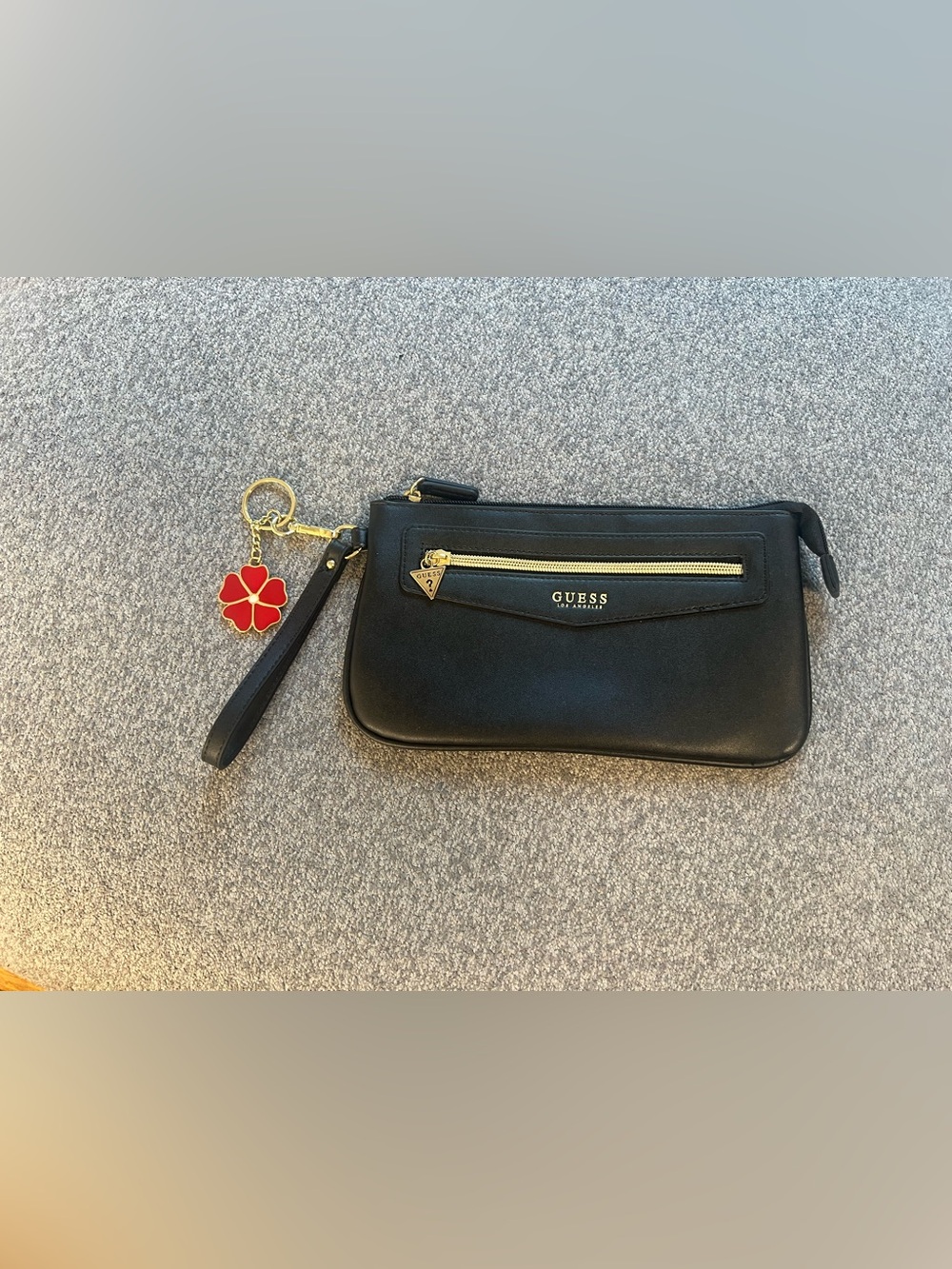 GUESS Black Wristlet with Gold Hardware and Red Flower Charm - Picture 2 of 8